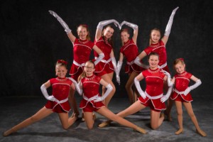 dancers in red costumes